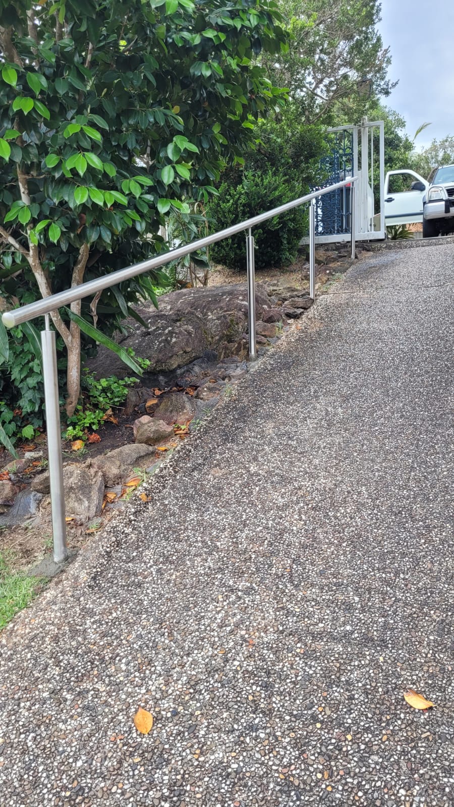 stainless steel handrail providing stability for seniors on outdoor steps