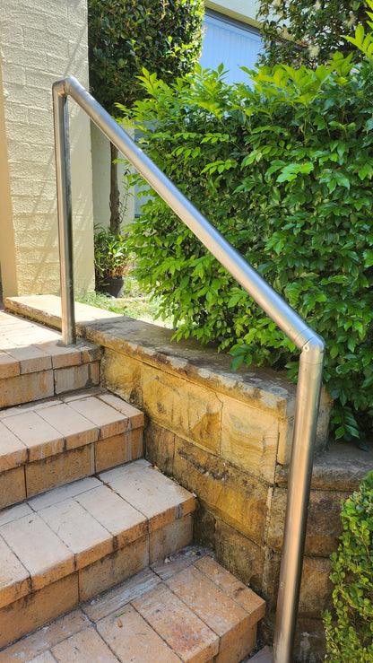 Durable stainless steel handrail providing stability for seniors on outdoor steps